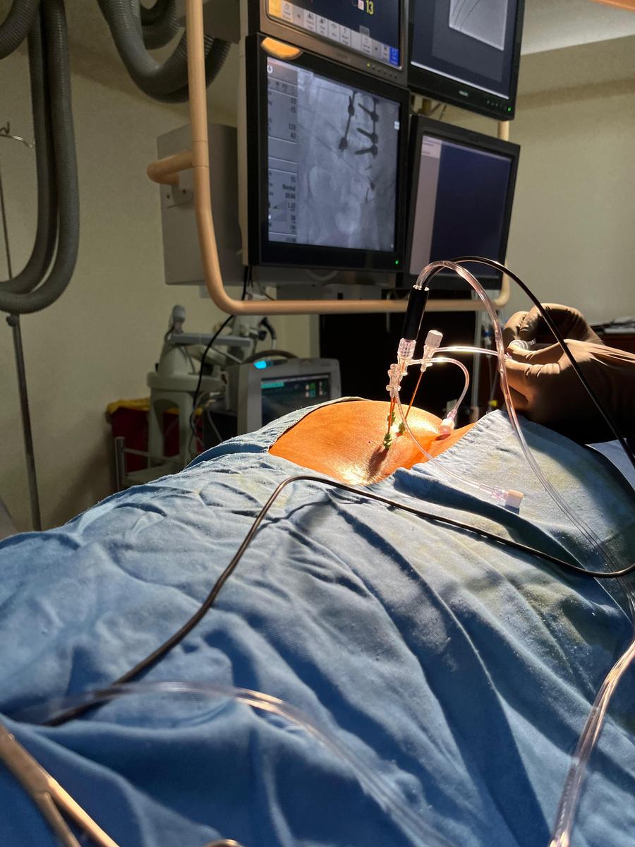 Doctor performing a lumbar injection procedure